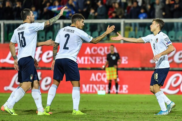 Italy's midfielder Nicolo Barella (C) celebrates with Italy's defender Alessio Romagnoli (L) and Italy's defender Giovanni Di Lorenzo after scoring during the Euro 2020 1st round Group J qualifying football match Italy v Armenia on November 18, 2019 at the Renzo-Barbera stadium in Palermo. (Photo by Andreas SOLARO / AFP) (Photo by ANDREAS SOLARO/AFP via Getty Images)