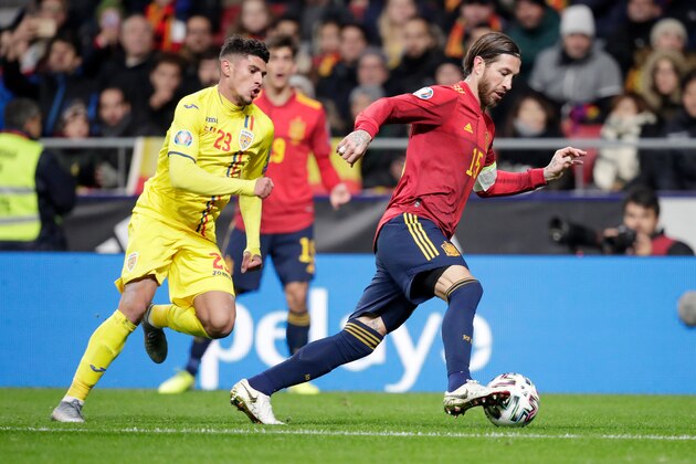 , SPAIN - NOVEMBER 18: (L-R) Florinel Coman of Romania, Sergio Ramos of Spain  during the  EURO Qualifier match between Spain  v Romania  at the Wanda Metropolitano stadium on November 18, 2019 (Photo by David S. Bustamante/Soccrates/Getty Images)