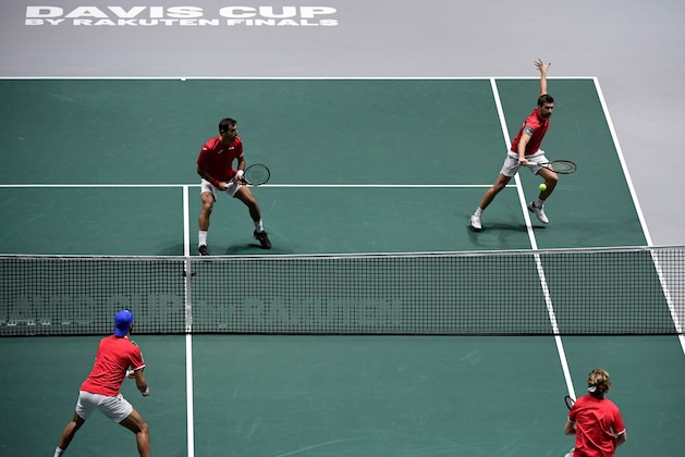 Croatia's Ivan Dodig and Croatia's Nikola Mektic return the ball to Russia's Karen Khachanov and Russia's Andrey Rublev during the doubles tennis match between Croatia and Russia at the Davis Cup Madrid Finals 2019 in Madrid on November 18, 2019. (Photo by JAVIER SORIANO / AFP) (Photo by JAVIER SORIANO/AFP via Getty Images)