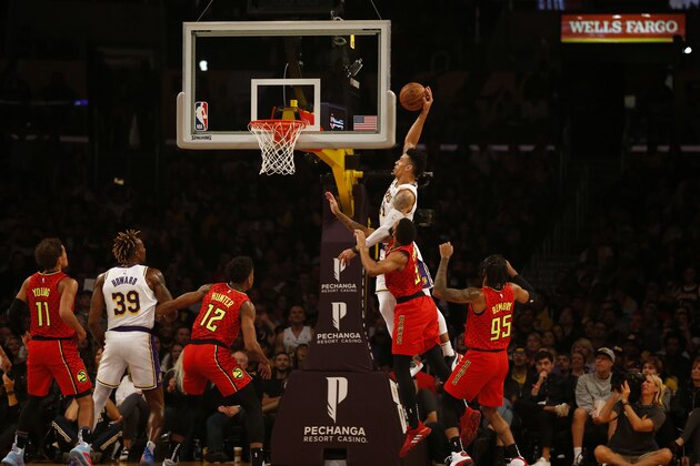 LOS ANGELES, CALIFORNIA - NOVEMBER 17:  Danny Green #14 of the Los Angeles Lakers dunks the ball as Allen Crabbe #33 of the Atlanta Hawks defends during the first half of a game at Staples Center on November 17, 2019 in Los Angeles, California. NOTE TO USER: User expressly acknowledges and agrees that, by downloading and or using this photograph, User is consenting to the terms and conditions of the Getty Images License Agreement.
 (Photo by Katharine Lotze/Getty Images)
