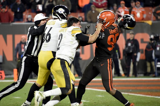 CLEVELAND, OHIO - NOVEMBER 14: Quarterback Mason Rudolph #2 of the Pittsburgh Steelers fights with defensive end Myles Garrett #95 of the Cleveland Browns during the second half at FirstEnergy Stadium on November 14, 2019 in Cleveland, Ohio. The Browns defeated the Steelers 21-7.  (Photo by Jason Miller/Getty Images)