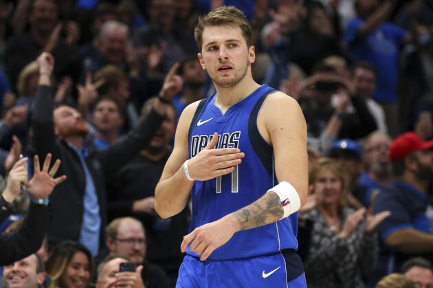 Dallas Mavericks forward Luka Doncic slaps his chest after hitting a three-point basket against the San Antonio Spurs in the second half in an NBA basketball game Monday, Nov. 18, 2019, in Dallas. (AP Photo/Richard W. Rodriguez)