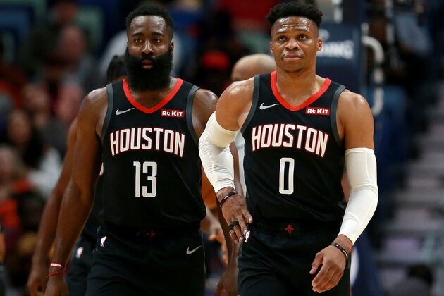 NEW ORLEANS, LOUISIANA - NOVEMBER 11: James Harden #13 of the Houston Rockets and Russell Westbrook #0 of the Houston Rockets stand on the court during a NBA game against the New Orleans Pelicans  at the Smoothie King Center on November 11, 2019 in New Orleans, Louisiana. NOTE TO USER: User expressly acknowledges and agrees that, by downloading and or using this photograph, User is consenting to the terms and conditions of the Getty Images License Agreement. (Photo by Sean Gardner/Getty Images)