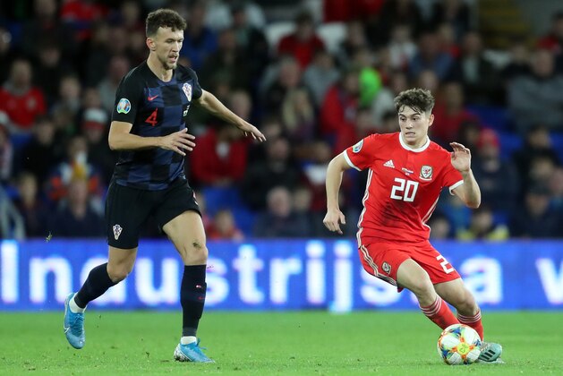CARDIFF, WALES - OCTOBER 13: Ivan Perisic of Croatia competes with Daniel James of Wales during the UEFA Euro 2020 qualifier between Wales and Croatia at Cardiff City Stadium on October 13, 2019 in Cardiff, Wales. (Photo by Sanjin Strukic Pixsell/MB Media/Getty Images) CARDIFF, WALES - OCTOBER 13: Ivan Perisic of Croatia competes with Daniel James of Wales during the UEFA Euro 2020 qualifier between Wales and Croatia at Cardiff City Stadium on October 13, 2019 in Cardiff, Wales. (Photo by Sanjin Strukic Pixsell/MB Media/Getty Images)