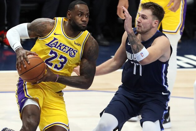 DALLAS, TEXAS - NOVEMBER 01:  LeBron James #23 of the Los Angeles Lakers dribbles the ball against Luka Doncic #77 of the Dallas Mavericks in the first quarter at American Airlines Center on November 01, 2019 in Dallas, Texas.  NOTE TO USER: User expressly acknowledges and agrees that, by downloading and or using this photograph, User is consenting to the terms and conditions of the Getty Images License Agreement. (Photo by Ronald Martinez/Getty Images)