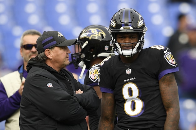 Baltimore Ravens offensive coordinator Marty Mornhinweg, left, speaks with quarterback Lamar Jackson before an NFL football game against the Cincinnati Bengals, Sunday, Nov. 18, 2018, in Baltimore. (AP Photo/Nick Wass)