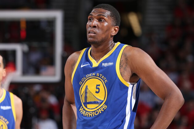 PORTLAND, OR - MAY 20:  Kevon Looney #5 of the Golden State Warriors looks on during Game Four of the Western Conference Finals against the Portland Trail Blazers on May 20, 2019 at the Moda Center in Portland, Oregon. NOTE TO USER: User expressly acknowledges and agrees that, by downloading and/or using this photograph, user is consenting to the terms and conditions of the Getty Images License Agreement. Mandatory Copyright Notice: Copyright 2019 NBAE (Photo by Sam Forencich/NBAE via Getty Images)