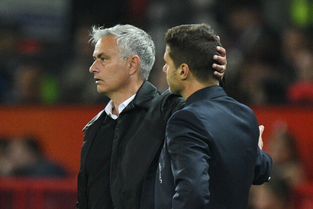 Manchester United's Portuguese manager Jose Mourinho (L) shakes hands with Tottenham Hotspur's Argentinian head coach Mauricio Pochettino (R) on the touchline towards the end of the English Premier League football match between Manchester United and Tottenham Hotspur at Old Trafford in Manchester, north west England, on August 27, 2018. (Photo by Oli SCARFF / AFP) / RESTRICTED TO EDITORIAL USE. No use with unauthorized audio, video, data, fixture lists, club/league logos or 'live' services. Online in-match use limited to 120 images. An additional 40 images may be used in extra time. No video emulation. Social media in-match use limited to 120 images. An additional 40 images may be used in extra time. No use in betting publications, games or single club/league/player publications. /         (Photo credit should read OLI SCARFF/AFP via Getty Images)