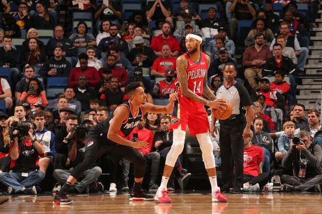 NEW ORLEANS, LA - NOVEMBER 19: Brandon Ingram #14 of the New Orleans Pelicans handles the ball CJ McCollum #3 of the Portland Trail Blazers on November 19, 2019 at Smoothie King Center in New Orleans, Louisiana. NOTE TO USER: User expressly acknowledges and agrees that, by downloading and/or using this photograph, User is consenting to the terms and conditions of the Getty Images License Agreement. Mandatory Copyright Notice: Copyright 2019 NBAE (Photo by Layne Murdoch Jr./NBAE via Getty Images)