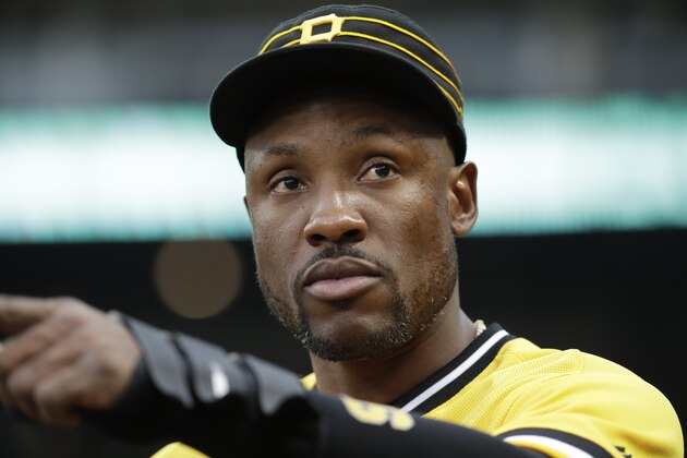 Pittsburgh Pirates' Starling Marte stands in the dugout during a baseball game against the Cincinnati Reds in Pittsburgh, Sunday, Sept. 29, 2019. Marte did not play in the game. The Reds won 3-1. (AP Photo/Gene J. Puskar)