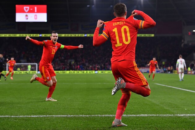 TOPSHOT - Wales' midfielder Aaron Ramsey (R) celebrates with Wales' forward Gareth Bale after scoring his team's second goal  during the Group E Euro 2020 football qualification match between Wales and HUngary at Cardiff City Stadium in Cardiff, Wales on November 19, 2019. (Photo by Paul ELLIS / AFP) (Photo by PAUL ELLIS/AFP via Getty Images)