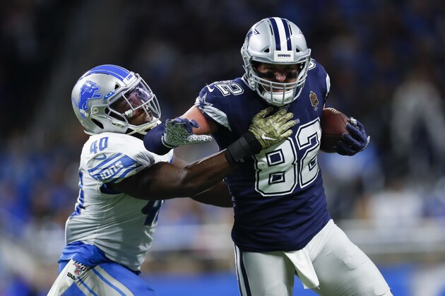 Dallas Cowboys tight end Jason Witten (82) tries to avoid Detroit Lions middle linebacker Jarrad Davis (40) during an NFL football game in Detroit, Sunday, Nov. 17, 2019. (AP Photo/Paul Sancya)