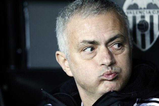Manchester United coach Jose Mourinho looks out from the bench prior a Group H Champions League soccer match between Valencia and Manchester United at the Mestalla Stadium in Valencia, Spain, Wednesday, Dec. 12, 2018. (AP Photo/Alberto Saiz)