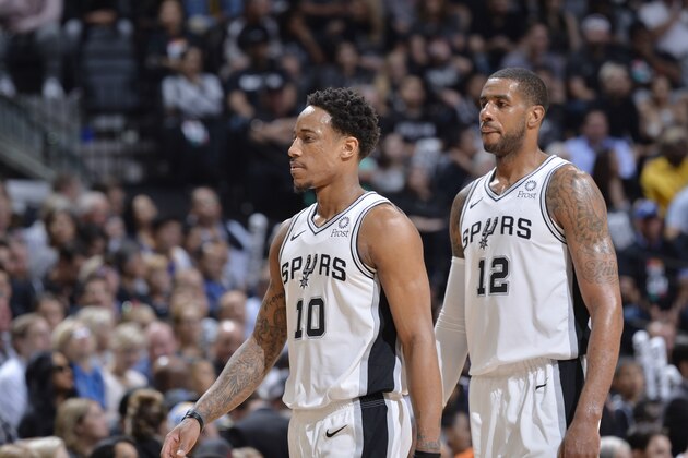 SAN ANTONIO, TX - APRIL 18: DeMar DeRozan #10 and LaMarcus Aldridge #12 of the San Antonio Spurs look on against the Denver Nuggets  during Game Three of Round One of the 2019 NBA Playoffs on April 18, 2019 at the AT&T Center in San Antonio, Texas. NOTE TO USER: User expressly acknowledges and agrees that, by downloading and or using this photograph, user is consenting to the terms and conditions of the Getty Images License Agreement. Mandatory Copyright Notice: Copyright 2019 NBAE (Photos by Mark Sobhani/NBAE via Getty Images)