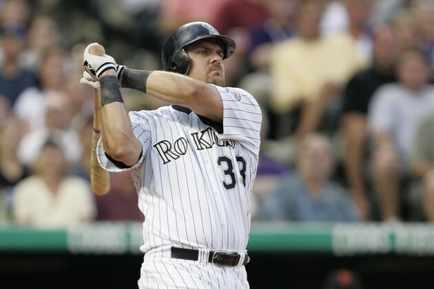 DENVER - JULY 17:  Right fielder Larry Walker #33 of the Colorado Rockies watches the flight of the ball as he follows through on a swing during the game against the San Francisco Giants at Coors Field on July 17, 2004 in Denver, Colorado.  The Giants won 4-0. (Photo by Brian Bahr/Getty Images)