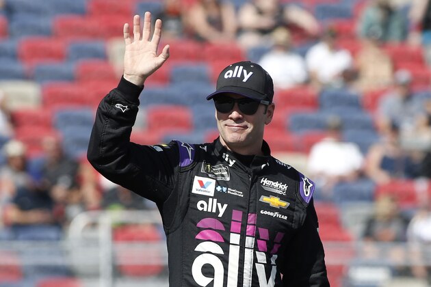 Jimmie Johnson waves during driver introductions prior to the NASCAR Cup Series auto race at ISM Raceway, Sunday, Nov. 10, 2019, in Avondale, Ariz. (AP Photo/Ralph Freso)