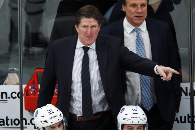 Toronto Maple Leafs head coach Mike Babcock directs his team against the Colorado Avalanche in the third period of an NHL hockey game, Tuesday, Feb. 12, 2019, in Denver. Toronto won 5-2. (AP Photo/David Zalubowski)