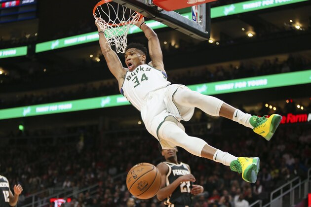 Milwaukee Bucks forward Giannis Antetokounmpo (34) dunks against the Atlanta Hawks in the first half of an NBA basketball game, Wednesday, Nov. 20, 2019, in Atlanta. (AP Photo/Brett Davis)