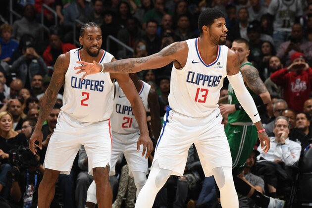 LOS ANGELES, CA - NOVEMBER 20: Kawhi Leonard #2, and Paul George #13 of the LA Clippers react to a play against the Boston Celtics on November 20, 2019 at STAPLES Center in Los Angeles, California. NOTE TO USER: User expressly acknowledges and agrees that, by downloading and/or using this Photograph, user is consenting to the terms and conditions of the Getty Images License Agreement. Mandatory Copyright Notice: Copyright 2019 NBAE (Photo by Andrew D. Bernstein/NBAE via Getty Images)