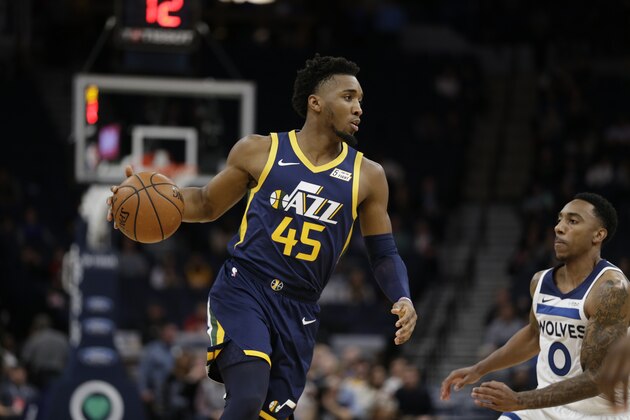 Utah Jazz guard Donovan Mitchell (45) drives on Minnesota Timberwolves guard Jeff Teague (0) during an NBA basketball game Wednesday, Nov. 20, 2019 in Minneapolis. (AP Photo/Andy Clayton-King)