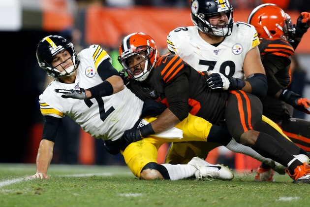 CLEVELAND, OH - NOVEMBER 14:  Mason Rudolph #2 of the Pittsburgh Steelers is knocked down by Myles Garrett #95 of the Cleveland Browns during the game at FirstEnergy Stadium on November 14, 2019 in Cleveland, Ohio. (Photo by Kirk Irwin/Getty Images)