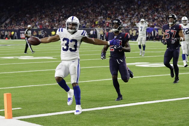 Indianapolis Colts running back Jonathan Williams (33) celebrates as he scores a touchdown against the Houston Texans during the second half of an NFL football game Thursday, Nov. 21, 2019, in Houston. (AP Photo/Mike Marshall)