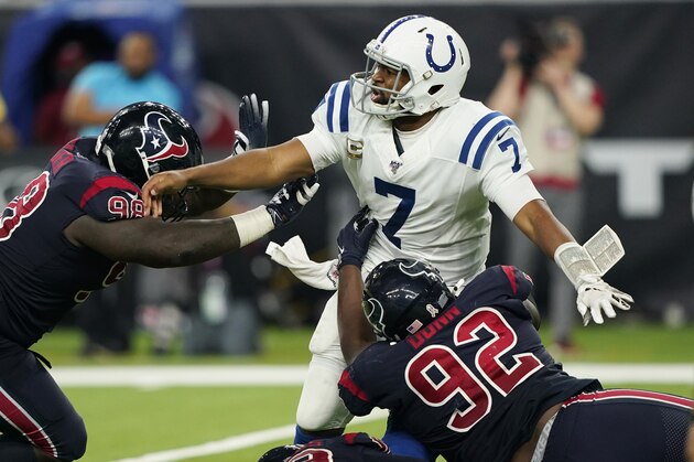 Indianapolis Colts quarterback Jacoby Brissett (7) is pressured by Houston Texans nose tackle Brandon Dunn (92) and defensive end D.J. Reader (98) during the second half of an NFL football game Thursday, Nov. 21, 2019, in Houston. (AP Photo/David J. Phillip)
