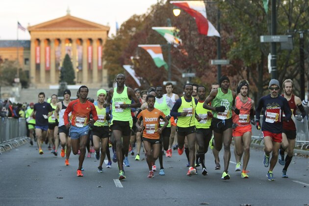 Runners make their way down the Benjamin Franklin Parkway in Philadelphia at the start of the Philadelphia Marathon, Sunday Nov. 20, 2016. (AP Photo/ Joseph Kaczmarek)