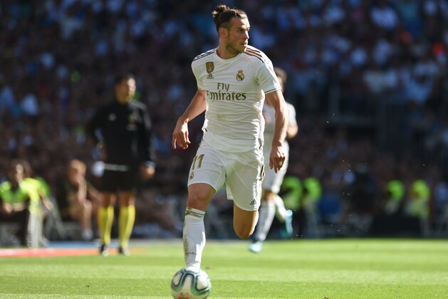 MADRID, SPAIN - OCTOBER 05: Gareth Bale of Real Madrid runs with the ball during the Liga match between Real Madrid CF and Granada CF at Estadio Santiago Bernabeu on October 05, 2019 in Madrid, Spain. (Photo by Denis Doyle/Getty Images)