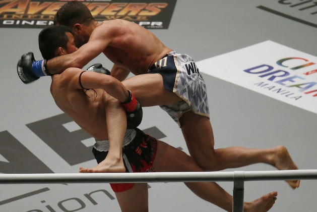 Thailand's Nong-O Gaiyanghadao, left, sweeps the leg of opponent Fabio Pinca of France during their ONE Championship Muay Thai bout Friday, April 20, 2018 at Mall of Asia Arena in suburban Pasay city south of Manila, Philippines. ONE Championship, Asia's premier martial arts organization, introduced the new ring instead of the octagon cage. Nong-O won over Pinca via unanimous decision. (AP Photo/Bullit Marquez)