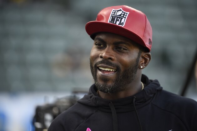 CARSON, CA - OCTOBER 13: Former NFL quarterback Michael Vick stands on the field before a game between the Pittsburgh Steelers and the Los Angeles Chargers at Dignity Health Sports Park October 13, 2019 in Carson, California.  (Photo by Denis Poroy/Getty Images)