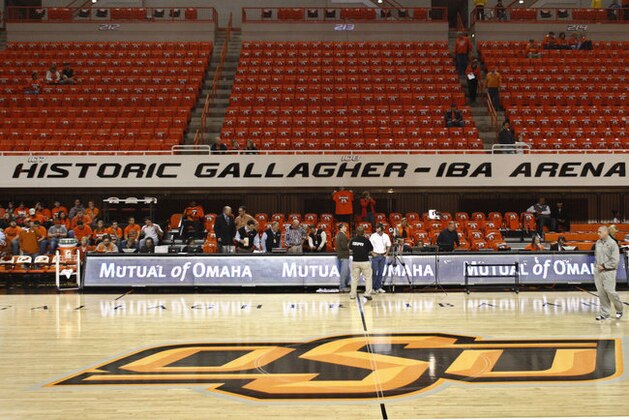 Fans begin to filter in at Gallagher-Iba Arena in Stillwater, Okla., for an NCAA college basketball game between Oklahoma State and Texas on Wednesday, Jan. 26, 2011. T-shirts with