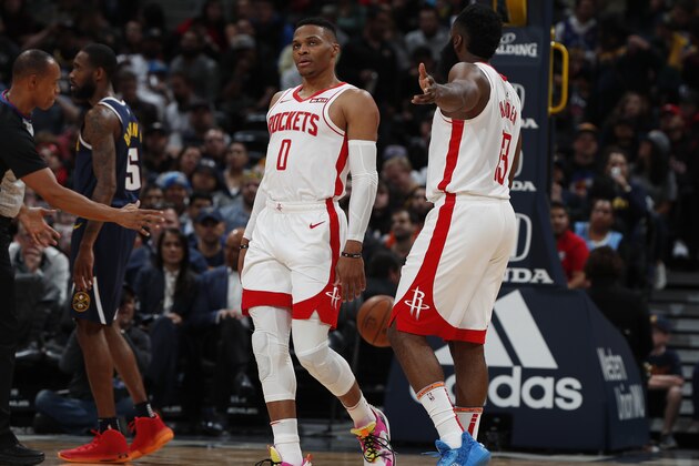 Houston Rockets guard Russell Westbrook (0) and Houston Rockets guard James Harden (13) in the second half of an NBA basketball game Wednesday, Nov. 20, 2019, in Denver. The Nuggets won 105-95. (AP Photo/David Zalubowski)