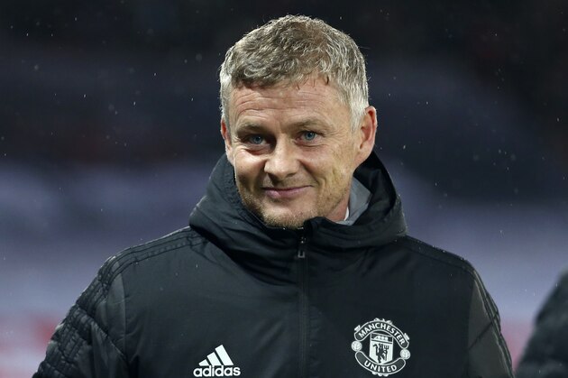Manchester United's manager Ole Gunnar Solskjaer smiles before the start of the Europa League group L soccer match between Manchester United and FK Partizan at Old Trafford Stadium in Manchester, England, Thursday, Nov. 7, 2019. (AP Photo/Dave Thompson)