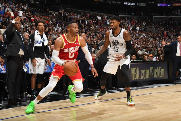 LOS ANGELES, CA - NOVEMBER 22: Russell Westbrook #0 of the Houston Rockets handles the ball against Paul George #13 of the LA Clippers on November 22, 2019 at STAPLES Center in Los Angeles, California. NOTE TO USER: User expressly acknowledges and agrees that, by downloading and/or using this Photograph, user is consenting to the terms and conditions of the Getty Images License Agreement. Mandatory Copyright Notice: Copyright 2019 NBAE (Photo by Andrew D. Bernstein/NBAE via Getty Images)
