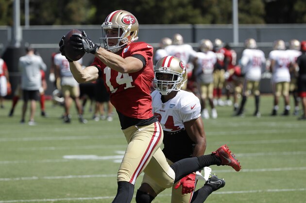 San Francisco 49ers' Max McCaffrey, top, catches a pass in front of K'Waun Williams at the team's NFL football training camp in Santa Clara, Calif., Monday, July 29, 2019. (AP Photo/Jeff Chiu)