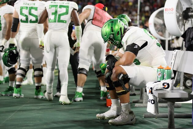 TEMPE, ARIZONA - NOVEMBER 23: Offensive lineman Penei Sewell #58 of the Oregon Ducks  reacts on the bench during the second half of the NCAAF game against the Arizona State Sun Devils at Sun Devil Stadium on November 23, 2019 in Tempe, Arizona. The Sun Devils defeated the Ducks 31-28.  (Photo by Christian Petersen/Getty Images)