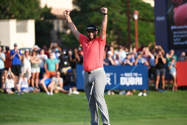 DUBAI, UNITED ARAB EMIRATES - NOVEMBER 24: Jon Rahm of Spain celebrates after putting in for a birdie on the eighteenth green to win the DP World Tour and Race to Dubai during Day Four of the DP World Tour Championship Dubai at Jumerirah Golf Estates on November 24, 2019 in Dubai, United Arab Emirates. (Photo by Ross Kinnaird/Getty Images)