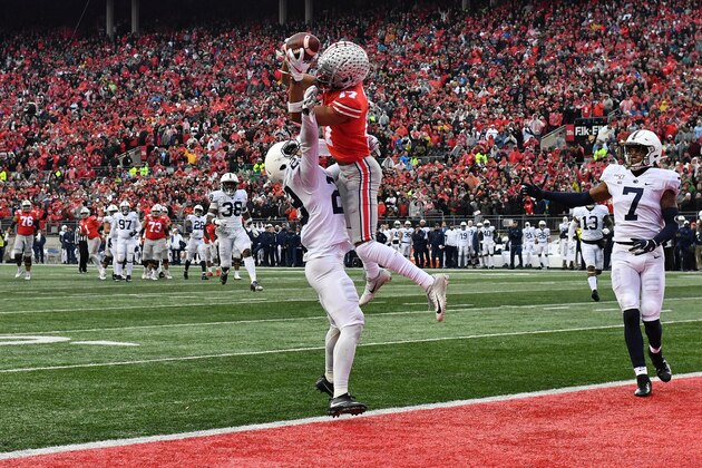 COLUMBUS, OH - NOVEMBER 23:  Chris Olave #17 of the Ohio State Buckeyes makes the catch for a 28-yard touchdown pass over John Reid #29 of the Penn State Nittany Lions in the fourth quarter  at Ohio Stadium on November 23, 2019 in Columbus, Ohio. Ohio State defeated Penn State 28-17.  (Photo by Jamie Sabau/Getty Images)