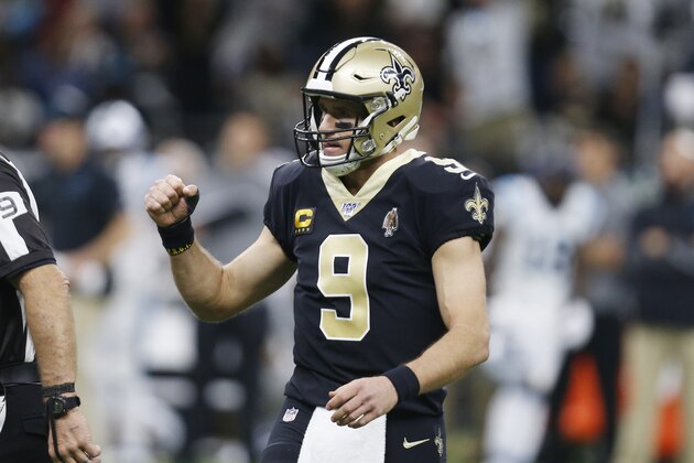 New Orleans Saints quarterback Drew Brees (9) gestures after throwing a touchdown pass to running back Latavius Murray, during the first half at an NFL football game against the Carolina Panthers Sunday, Nov. 24, 2019, in New Orleans. (AP Photo/Butch Dill)