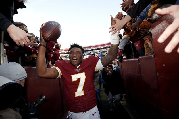 Washington Redskins quarterback Dwayne Haskins runs off the field after an NFL football game against the Detroit Lions, Sunday, Nov. 24, 2019, in Landover, Md. The Redskins won 19-16. (AP Photo/Alex Brandon)