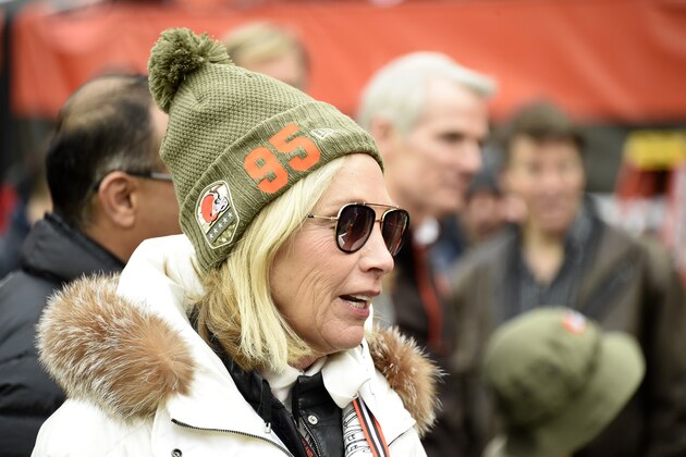 CLEVELAND, OHIO - NOVEMBER 24: Team owner Dee Haslam of the Cleveland Browns talks with guests on the sidelines while wearing a hat supporting defensive end Myles Garrett #95 prior to the game against the Miami Dolphins at FirstEnergy Stadium on November 24, 2019 in Cleveland, Ohio. (Photo by Jason Miller/Getty Images)