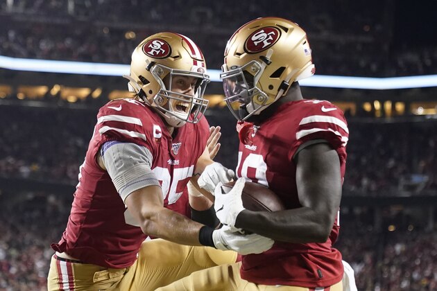 San Francisco 49ers wide receiver Deebo Samuel, right, is congratulated by tight end George Kittle after scoring against the Green Bay Packers during the first half of an NFL football game in Santa Clara, Calif., Sunday, Nov. 24, 2019. (AP Photo/Tony Avelar)