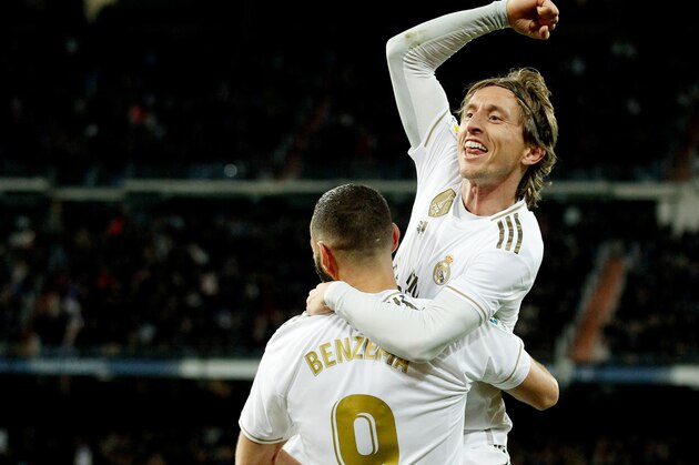 MADRID, SPAIN - NOVEMBER 23: Luka Modric of Real Madrid celebrates 3-1 with Karim Benzema of Real Madrid  during the La Liga Santander  match between Real Madrid v Real Sociedad at the Santiago Bernabeu on November 23, 2019 in Madrid Spain (Photo by David S. Bustamante/Soccrates/Getty Images)