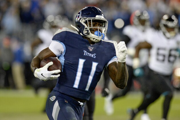 Tennessee Titans wide receiver A.J. Brown (11) scores a touchdown on a 65-yard pass reception against the Jacksonville Jaguars in the second half of an NFL football game Sunday, Nov. 24, 2019, in Nashville, Tenn. (AP Photo/Mark Zaleski)