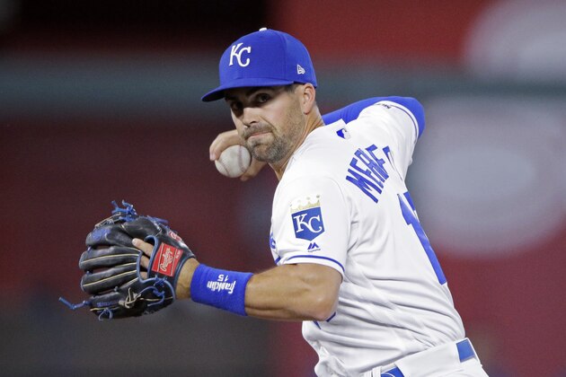 CORRECTS PLAYER TO SECOND BASEMAN WHIT MERRIFIELD, INSTEAD OF PITCHER MIKE MONTGOMERY, AND PLAY - Kansas City Royals second baseman Whit Merrifield throws to first after forcing Atlanta Braves' Dansby Swanson out at second on a force out hit into by Ozzie Albies during the first inning of a baseball game Wednesday, Sept. 25, 2019, in Kansas City, Mo. (AP Photo/Charlie Riedel)