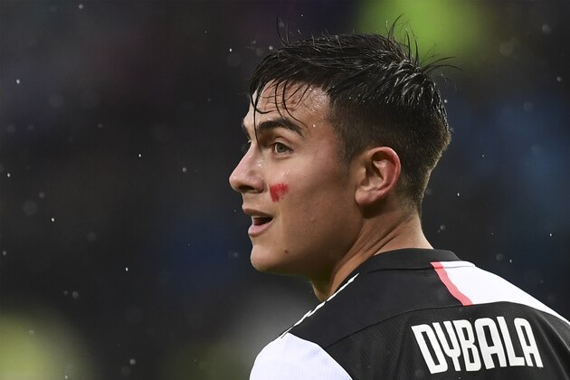 Juventus' Argentine forward Paulo Dybala has a red streak on his cheek as part of an initiative targeting domestic violence against women, during the Italian Serie A football match Atalanta Bergamo vs Juventus on November 23, 2019 at the Atleti Azzurri d'Italia stadium in Bergamo. - The