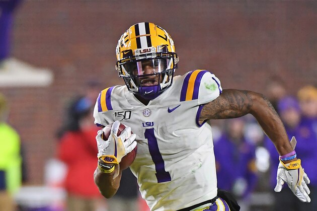 LSU wide receiver Ja'Marr Chase (1) carries the ball during the second half of an NCAA college football game against Mississippi in Oxford, Miss., Saturday, Nov. 16, 2019. No. 1 LSU won 58-37. (AP Photo/Thomas Graning)