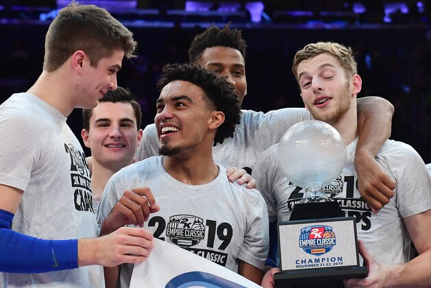NEW YORK, NEW YORK - NOVEMBER 22: Tre Jones #3 smiles at Joey Baker #13 of the Duke Blue Devils after a 81-73 win over the Georgetown Hoyas for the 2K Empire Classic tournament trophy at Madison Square Garden on November 22, 2019 in New York City. (Photo by Emilee Chinn/Getty Images)