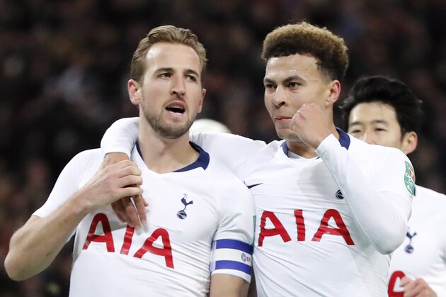 Tottenham's Harry Kane, left, celebrates with teammate Dele Alli after scoring his side first goal during the English League Cup semifinal first leg soccer match between Tottenham Hotspur and Chelsea at Wembley Stadium in London, Tuesday, Jan. 8, 2019. (AP Photo/Frank Augstein)